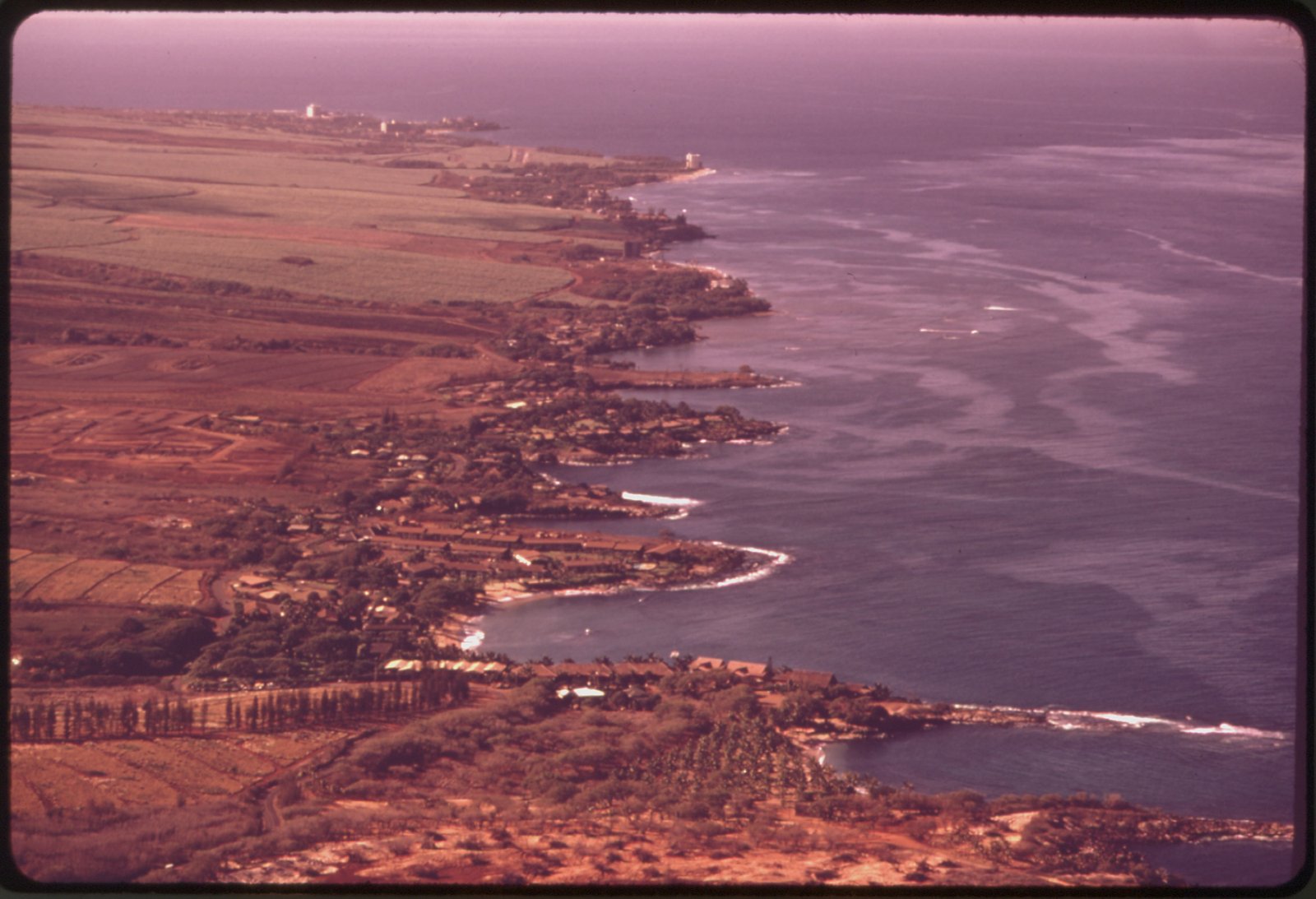 HOTELS AND CONDOMINIUMS ARE SPRINGING UP IN THE RAPIDLY DEVELOPING KAANAPALI AREA OF MAUI. THE LAND IS A MIXTURE OF... - NARA - 554057.jpg